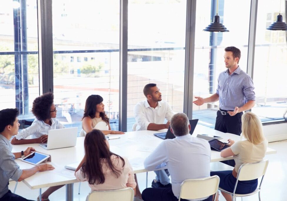 A group of people sitting around a table.